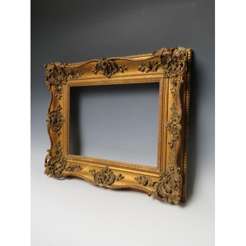 80 - A 19TH CENTURY GOLD SWEPT FRAME, frame W 9 cm, rebate 29 x 39 cm