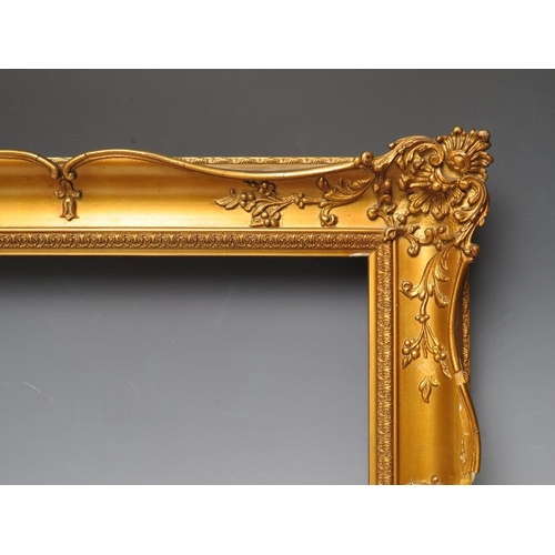 84 - A 19TH CENTURY GOLD SWEPT FRAME, frame W 6.5 cm, rebate 28.5 x 38 cm