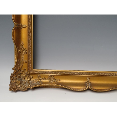 84 - A 19TH CENTURY GOLD SWEPT FRAME, frame W 6.5 cm, rebate 28.5 x 38 cm