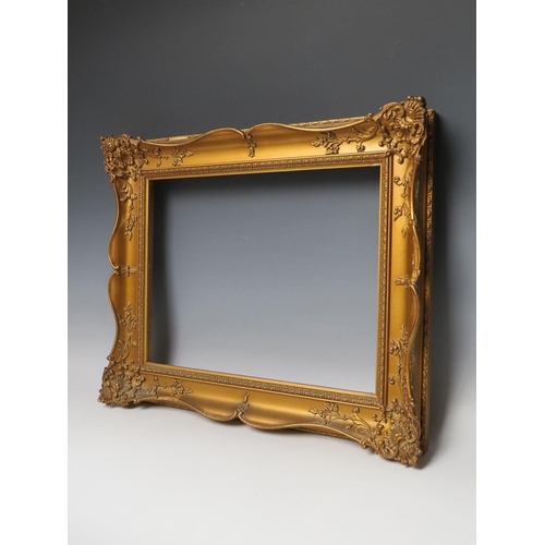 84 - A 19TH CENTURY GOLD SWEPT FRAME, frame W 6.5 cm, rebate 28.5 x 38 cm