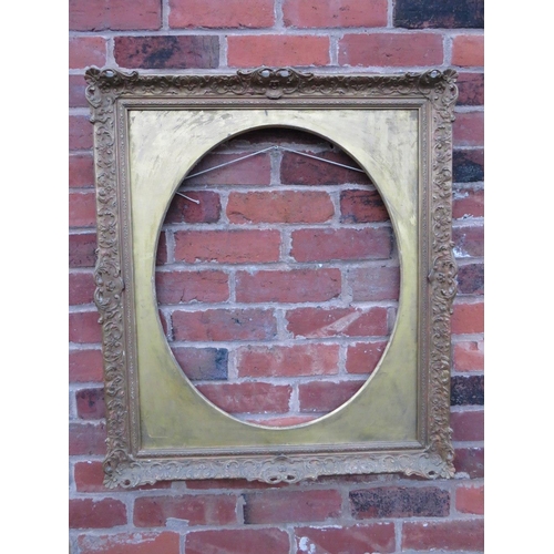 90 - A 20TH CENTURY DECORATIVE GOLD SWEPT FRAME WITH OVAL GOLD SPANDREL, frame W 7.5 cm, spandrel site si... 