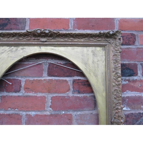 90 - A 20TH CENTURY DECORATIVE GOLD SWEPT FRAME WITH OVAL GOLD SPANDREL, frame W 7.5 cm, spandrel site si... 