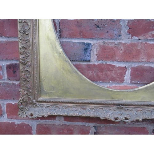 90 - A 20TH CENTURY DECORATIVE GOLD SWEPT FRAME WITH OVAL GOLD SPANDREL, frame W 7.5 cm, spandrel site si... 