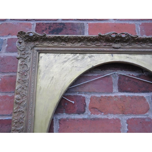 90 - A 20TH CENTURY DECORATIVE GOLD SWEPT FRAME WITH OVAL GOLD SPANDREL, frame W 7.5 cm, spandrel site si... 