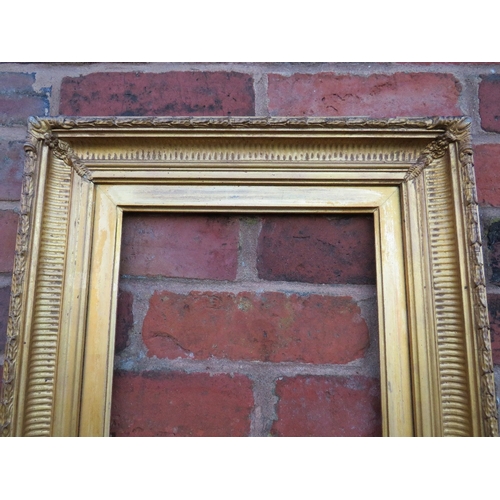 52 - A 19TH CENTURY GOLD FRAME WITH REEDED INNER DESIGN AND ACANTHUS LEAF DESIGN TO OUTER EDGE, with gold... 