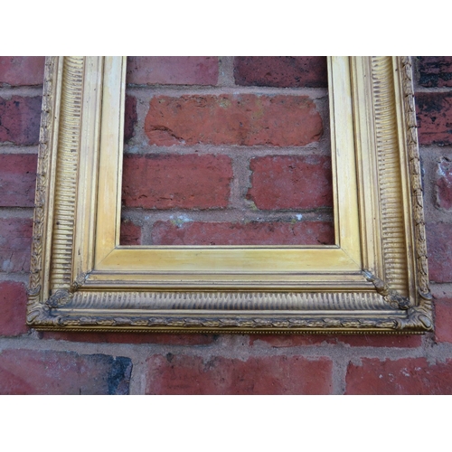 52 - A 19TH CENTURY GOLD FRAME WITH REEDED INNER DESIGN AND ACANTHUS LEAF DESIGN TO OUTER EDGE, with gold... 