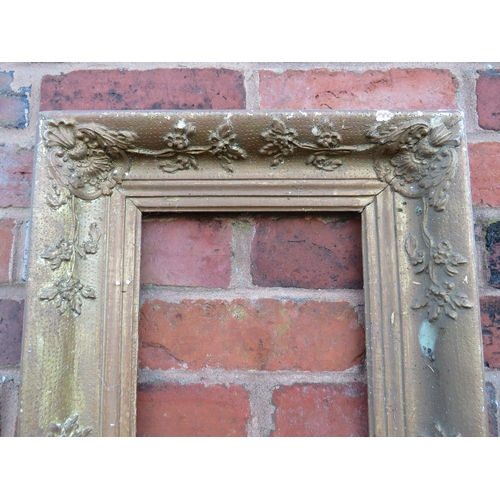 54 - AN 18TH CENTURY DECORATIVE GOLD FRAME IN NEED OF SOME RESTORATION, frame W 9 cm, rebate 23 x 31 cm