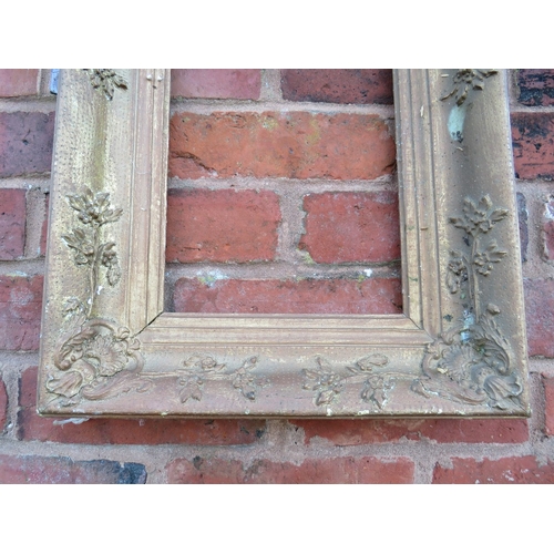 54 - AN 18TH CENTURY DECORATIVE GOLD FRAME IN NEED OF SOME RESTORATION, frame W 9 cm, rebate 23 x 31 cm