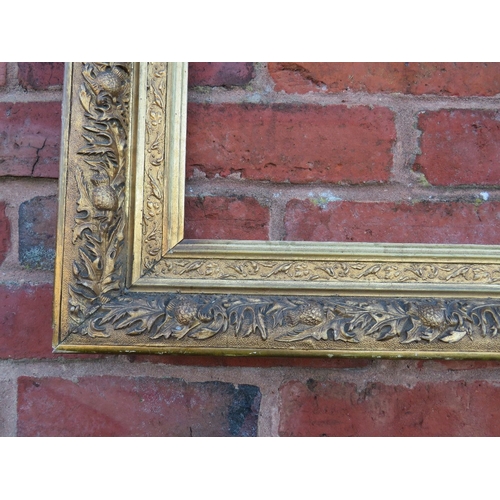 55 - A 19TH CENTURY GOLD FRAME WITH THISTLE DESIGN, frame W 9 cm, rebate 40 x 32 cm