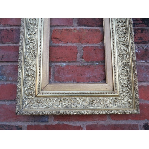 61 - A 19TH CENTURY GOLD FRAME WITH INNER LEAF DESIGN, acanthus leaf design to outer edge and gold slip, ... 