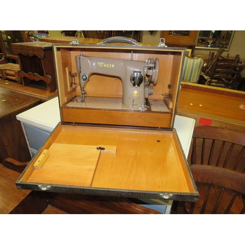 861 - A CASED SINGER ELECTRIC SEWING MACHINE