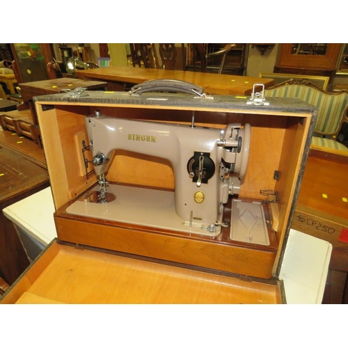 861 - A CASED SINGER ELECTRIC SEWING MACHINE