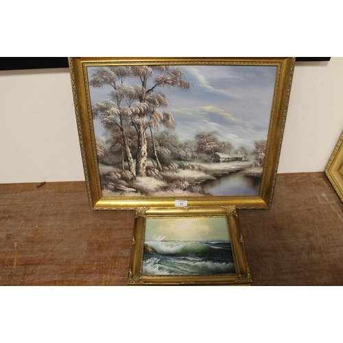 41 - TWO GILT FRAMED OIL ON CANVAS OF A RIVER SCENE AND A ROCKY COASTAL ROAD