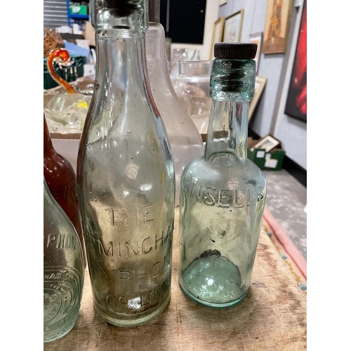 56 - A COLLECTION OF VINTAGE / ADVERTISING BOTTLES TO INCLUDE LOCAL EXAMPLES