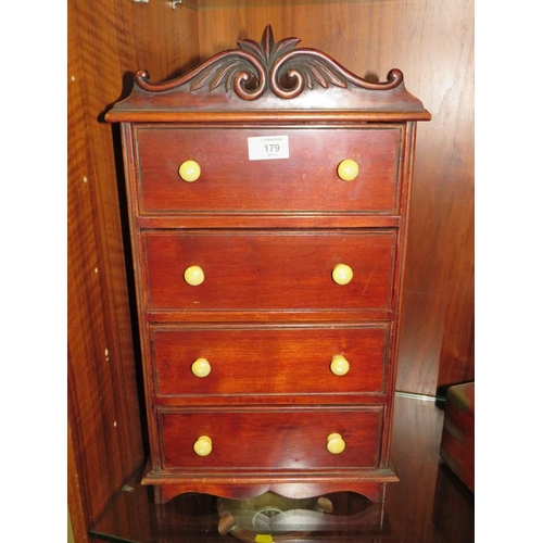 179 - A TABLE TOP / MINIATURE CHEST OF FOUR DRAWERS