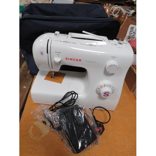 74A - A SINGER TRADITION SEWING MACHINE WITH FABRIC CARRY CASE