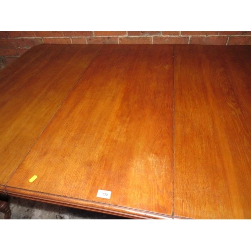 750 - AN EDWARDIAN OAK WIND-OUT DINING TABLE WITH ONE SPARE LEAF