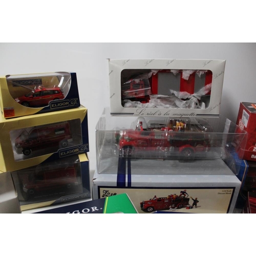 40 - A TRAY CONTAINING SIXTEEN EMERGENCY SERVICES VEHICLES / FIGURES, to include First Gear 1:34 scale Ma... 