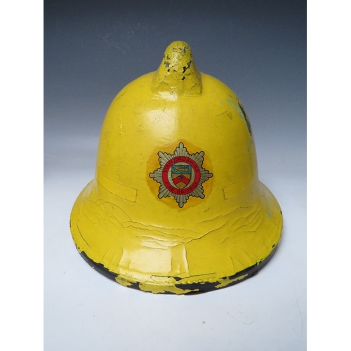 297 - TWO STAFFORDSHIRE CORK BASE FIRE HELMETS, small size dated 1976 and 1985