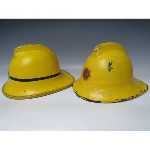 297 - TWO STAFFORDSHIRE CORK BASE FIRE HELMETS, small size dated 1976 and 1985