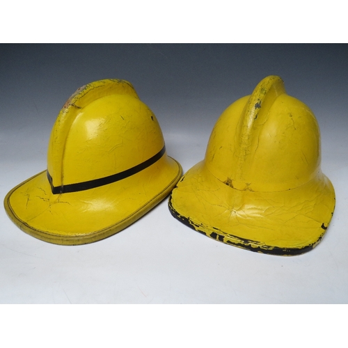 297 - TWO STAFFORDSHIRE CORK BASE FIRE HELMETS, small size dated 1976 and 1985