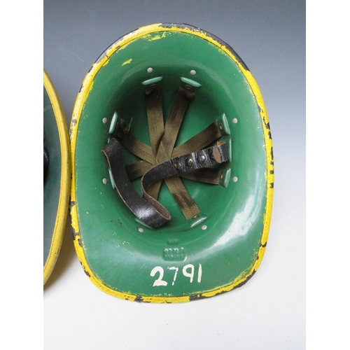 297 - TWO STAFFORDSHIRE CORK BASE FIRE HELMETS, small size dated 1976 and 1985