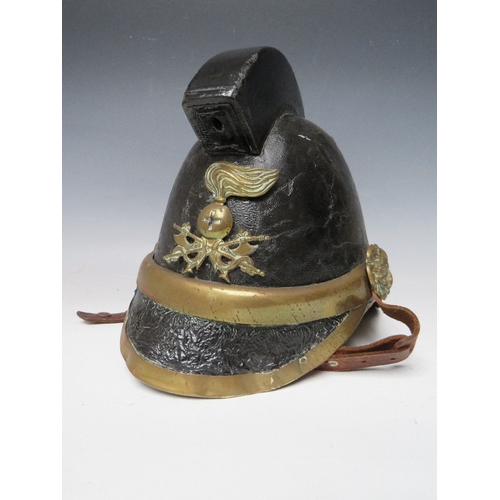 300 - A VICTORIAN MERRYWEATHER LEATHER FIREMANS HELMET, with brass banding and head badge