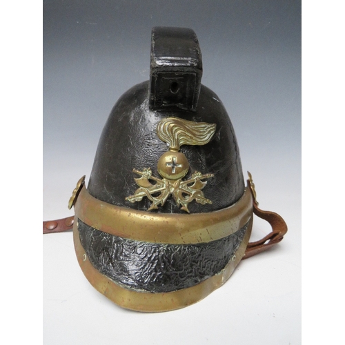 300 - A VICTORIAN MERRYWEATHER LEATHER FIREMANS HELMET, with brass banding and head badge