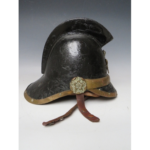 300 - A VICTORIAN MERRYWEATHER LEATHER FIREMANS HELMET, with brass banding and head badge