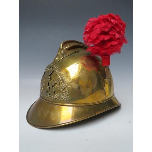 301 - A 19TH CENTURY FRENCH BRASS FIREMANS HELMET, with Sapeurs Pompiere Montrevil badge and side plume