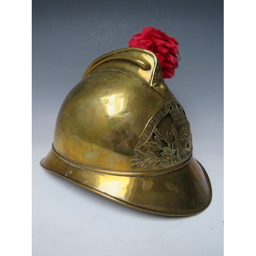 301 - A 19TH CENTURY FRENCH BRASS FIREMANS HELMET, with Sapeurs Pompiere Montrevil badge and side plume