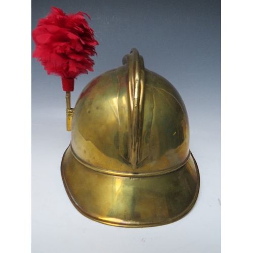 301 - A 19TH CENTURY FRENCH BRASS FIREMANS HELMET, with Sapeurs Pompiere Montrevil badge and side plume