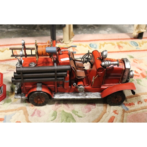 187 - CAST IRON FIRE STATION / FIRE ENGINE MONEY BOX TOGETHER WITH A TIN PLATE FIRE ENGINE