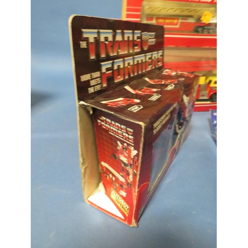 225 - THREE BOXED TRANSFORMERS, to include Siren, Horsehead and Inferno, two Majorette fire engines, two b... 