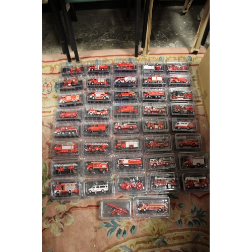 212 - FIFTY FIRE ENGINES IN CLEAR PLASTIC SEALED BOXES