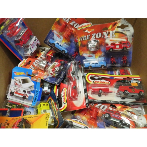 253 - TWENTY SIX CARDED EMERGENCY VEHICLES / SETS, mainly by Majorette, together with three box sets by Ho... 