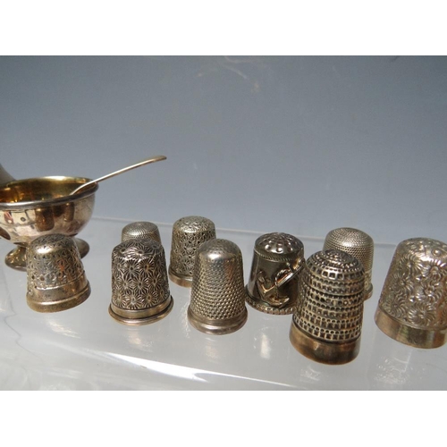 194 - A COLLECTORS CABINET AND  CONTENTS, to include a collection of hallmarked silver and ceramic thimble... 