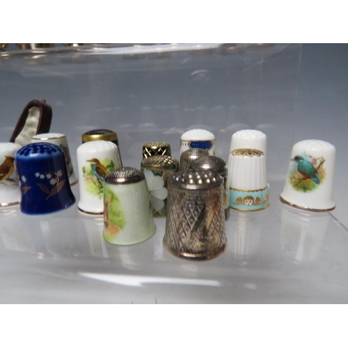 194 - A COLLECTORS CABINET AND  CONTENTS, to include a collection of hallmarked silver and ceramic thimble... 