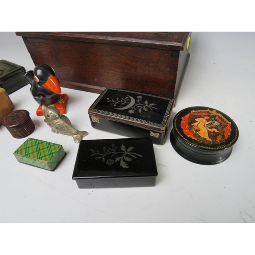 202 - A VINTAGE OAK LIDDED BOX AND CONTENTS, containing a selection of collectable boxes etc., to include ... 