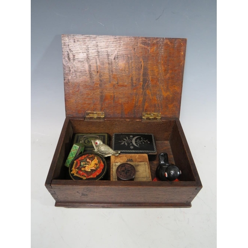 202 - A VINTAGE OAK LIDDED BOX AND CONTENTS, containing a selection of collectable boxes etc., to include ... 