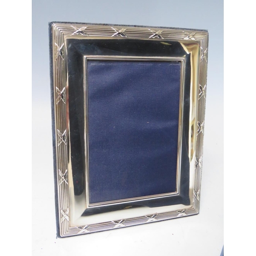 206 - A COLLECTION OF FOUR HALLMARKED SILVER EASEL BACKED PHOTO FRAMES, varying sizes, dates and makers, t... 