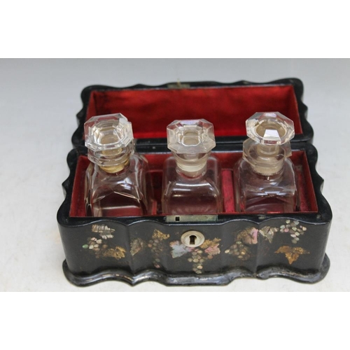 212 - AN ANTIQUE PAPIER MACHE TRIPLE SCENT BOTTLE CASKET, having matched bottles to interior, one bottle l... 