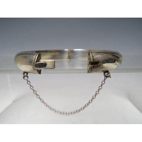 241 - A HALLMARKED SILVER HINGED BANGLE