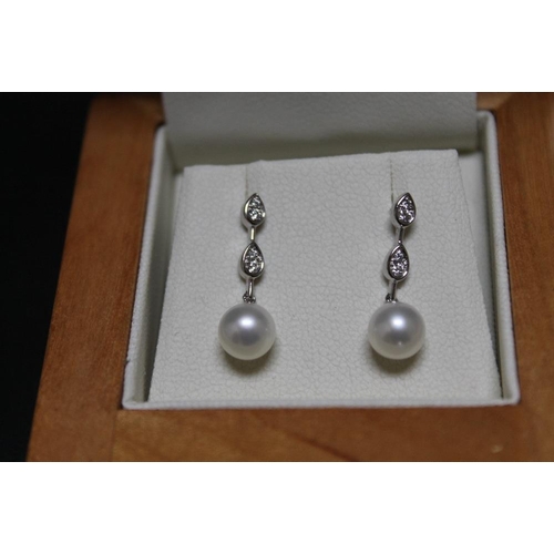 296 - A PAIR OF FRESHWATER CULTURED PEARL AND DIAMOND EARRINGS BY RUDELL'S, on butterfly setting with back... 