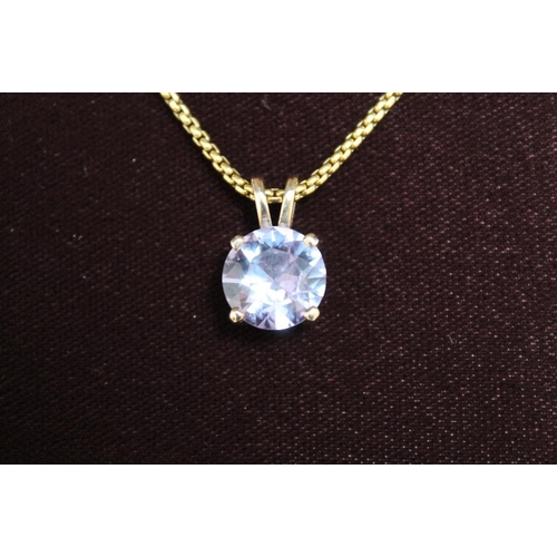 297 - A HALLMARKED 9 CARAT GOLD PENDANT ON SHORT CHAIN, with additional length of chain in box, set with a... 