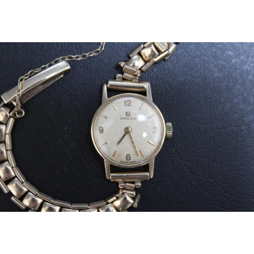 318 - OMEGA - A HALLMARKED 9 CARAT GOLD LADIES WRIST WATCH, with an Omega box, presentation engraving to b... 