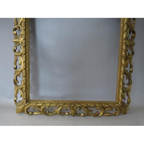 32 - A 19TH CENTURY CARVED WOODEN FLORENTINE GOLD FRAME, frame W 10 cm, rebate 62 x 46 cm