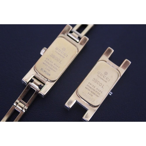 327 - A LADIES RECTANGULAR GOLD EFFECT GUCCI WRIST WATCH, together with spare movement housing, W 1.25 cm