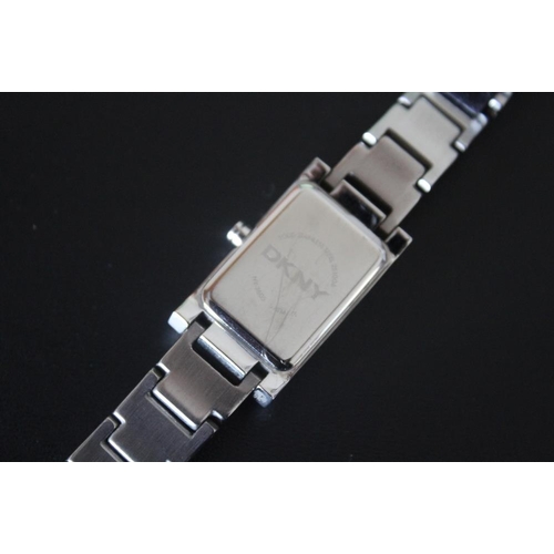 329 - A LADIES RECTANGULAR DKNY STAINLESS STEEL WRISTWATCH, W 2 cm