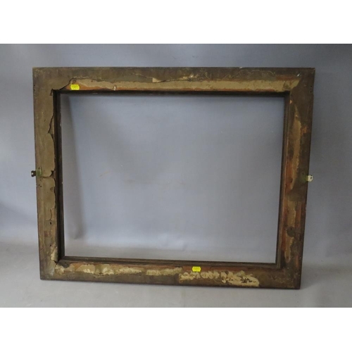 35 - A 19TH CENTURY OAK FRAME WITH CARVED LEAF DESIGN, frame W 7 cm, rebate 50 x 65 cm